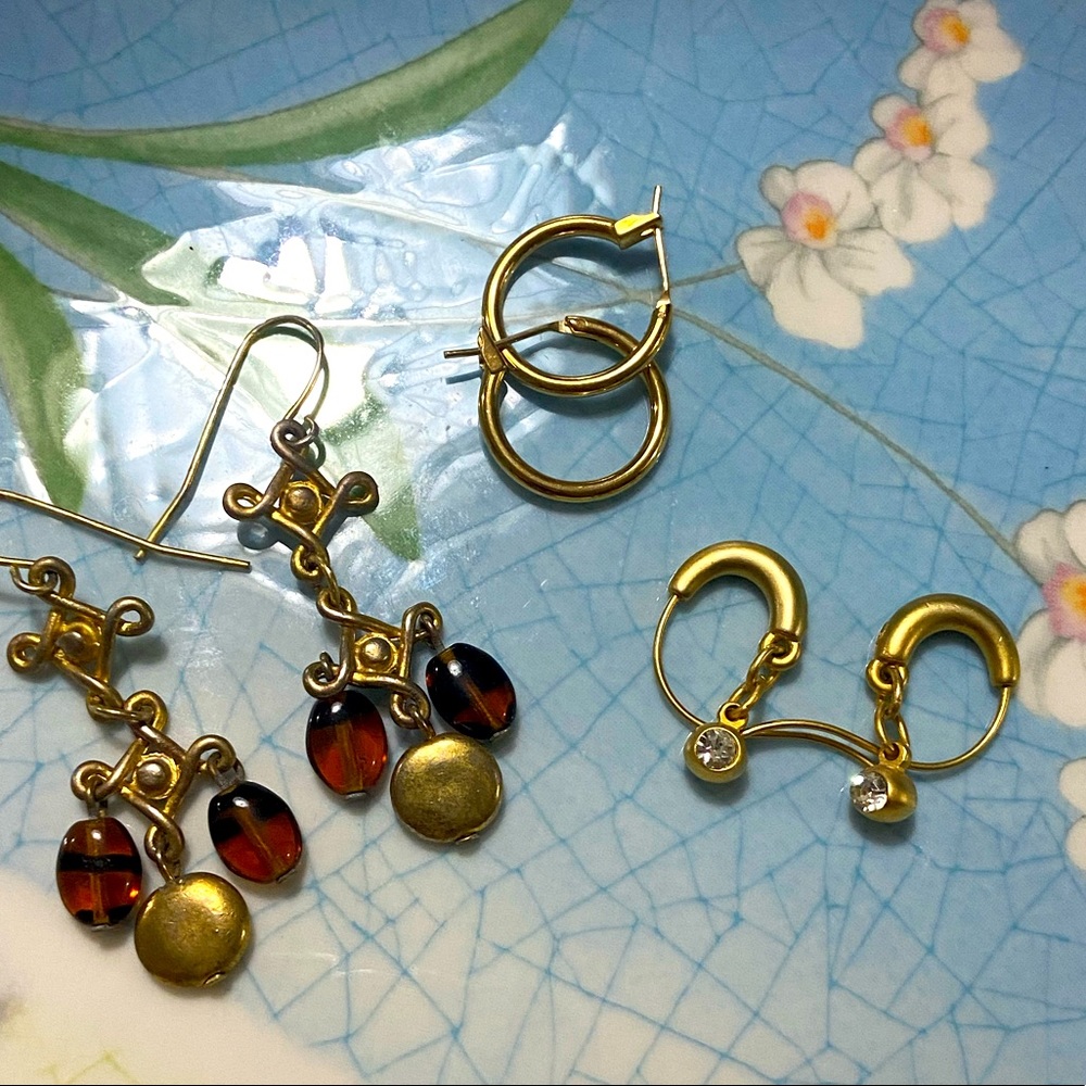 Three pairs gold plated earrings